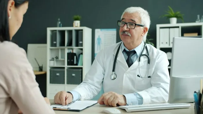 Physician and patient meeting in a modern office